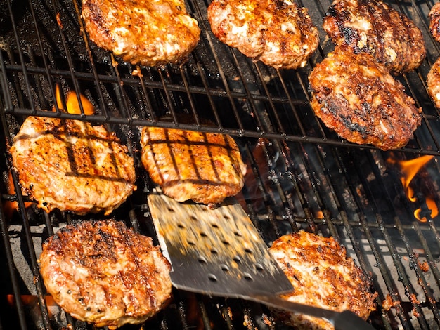 Gourmet hamburger parries on the grill.