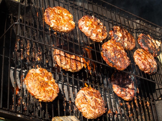 Gourmet hamburger parries on the grill.