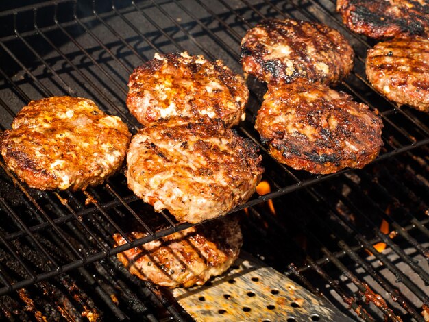 Gourmet hamburger parries on the grill.