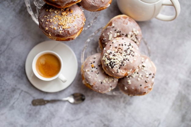 Gourmet Homemade Polish Paczki Donuts with coffee, top view