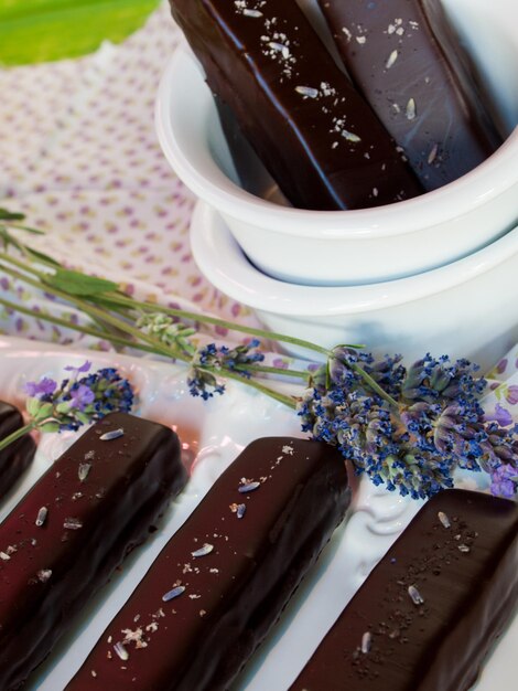 Gourmet lavender chocolate bars on white seving plate.