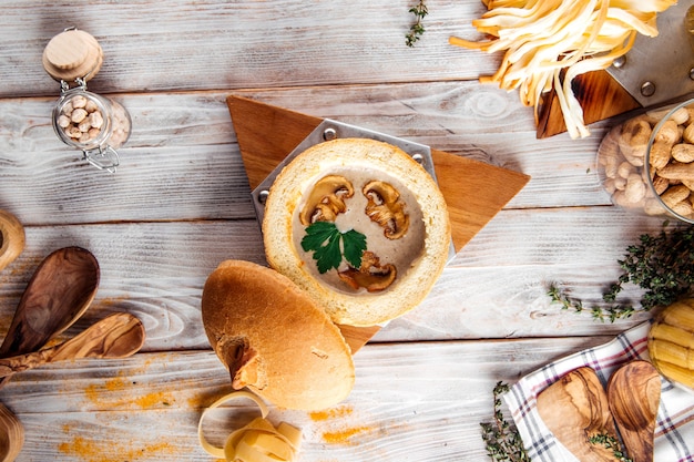 Gourmet mushroom cream soup in a bread bowl