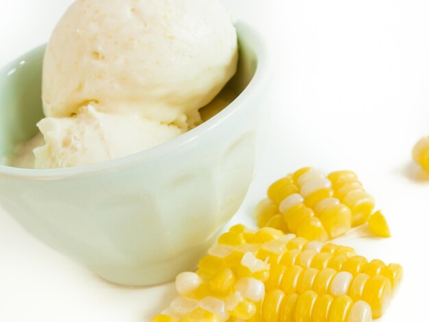 Gourmet Olathe sweet corn gelato on white background.