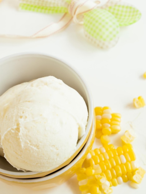 Gourmet Olathe sweet corn gelato on white background.