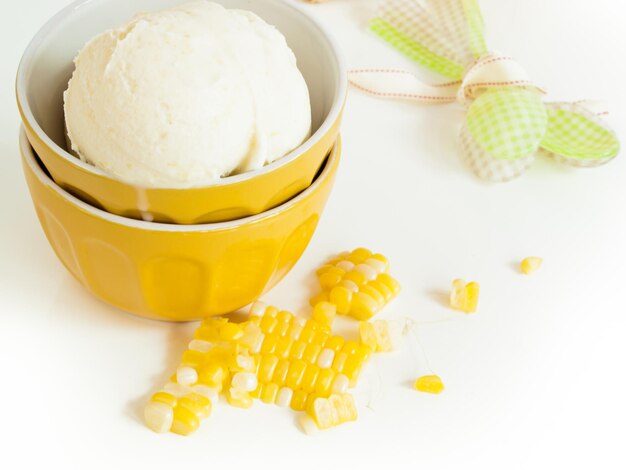 Gourmet Olathe sweet corn gelato on white background.