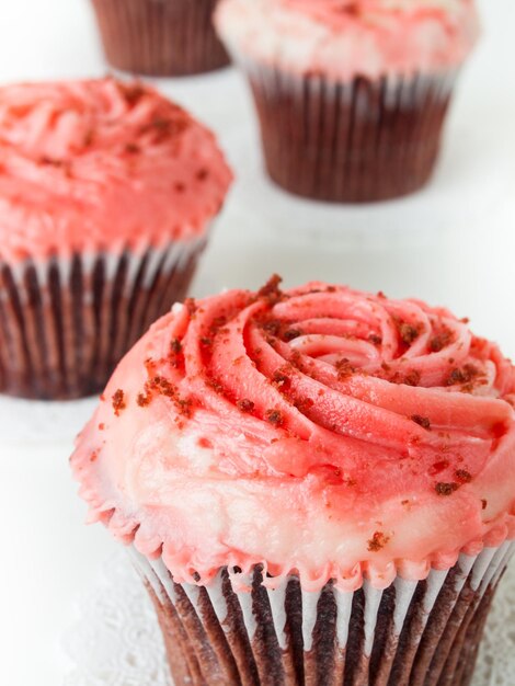 Gourmet red welveet cupcake on white background.