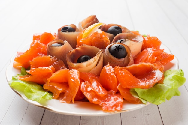 Gourmet restaurant serving a plate of smoked salt, raw white fish fillets and salmon