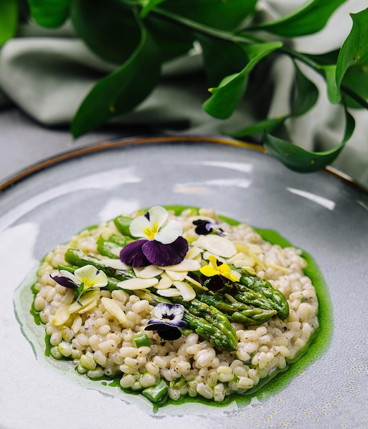 gourmet risotto with asparagus and edible flowers