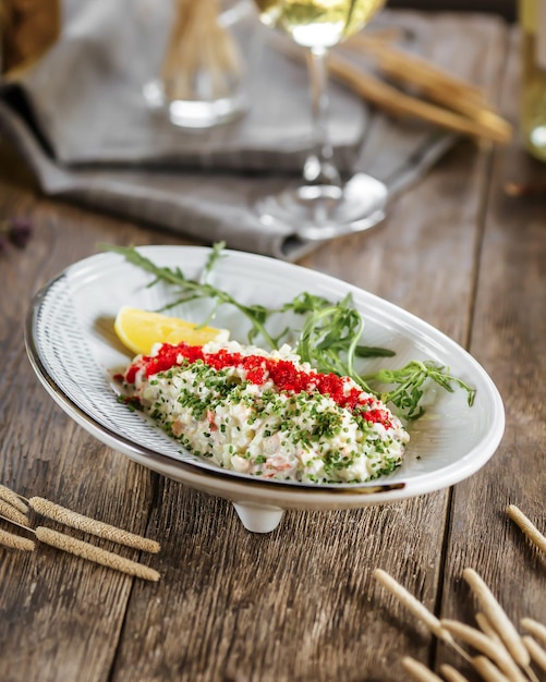 Gourmet salad with caviar and crab sticks