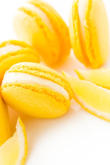 Gourmet small colorful French macarons with lemon flavor.