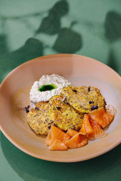 Gourmet smoked salmon with herb pancakes