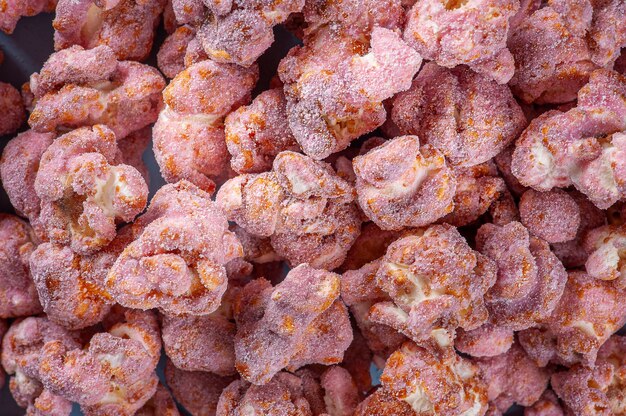 Gourmet sweet popcorn in close-up photo. Strawberry flavor. Top view