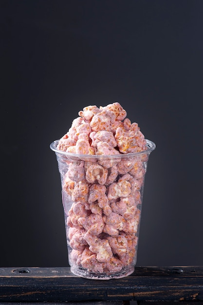 Gourmet sweet popcorn in a plastic cup