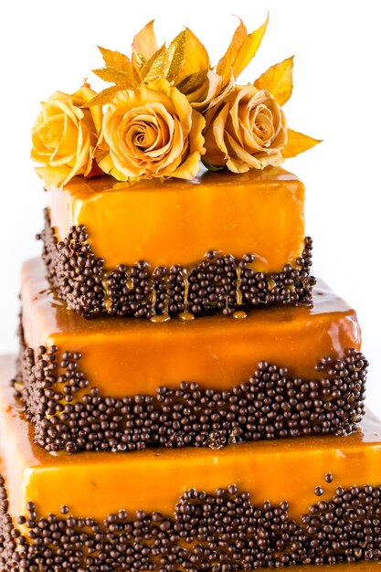 Gourmet tiered wedding cake as centerpiece at the wedding reception