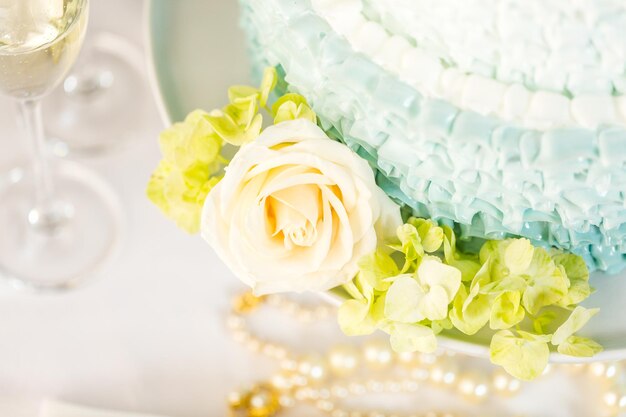 Gourmet tiered wedding cake as centerpiece at the wedding reception.