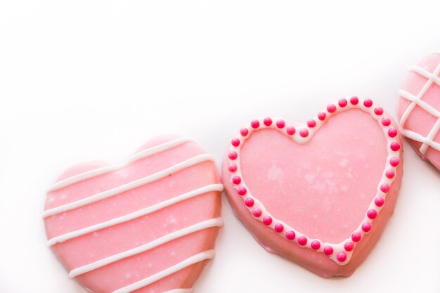 Gourtmet heart shaped cookies decorated for Valentine's Day.