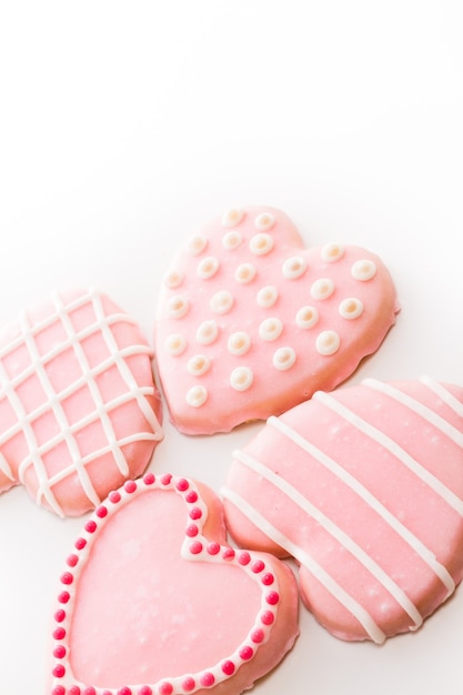 Gourtmet heart shaped cookies decorated for Valentine's Day.