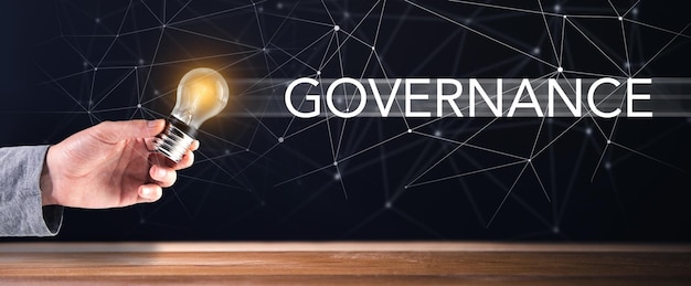 Governance and light bulb in hand