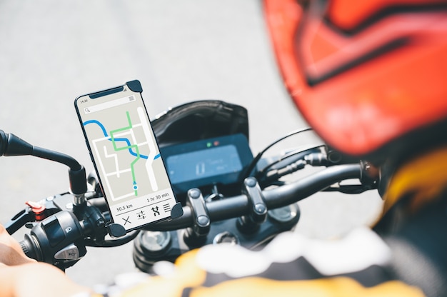 GPS app in a smartphone installed at motorcycle handle bar for navigator