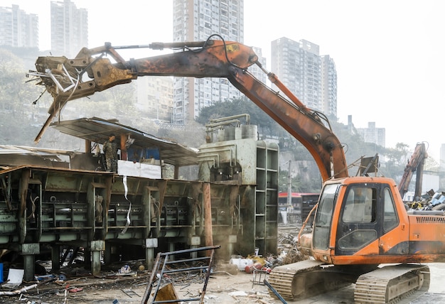 Grab crane works in waste recycling station