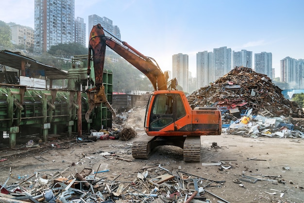 Grab crane works in waste recycling station