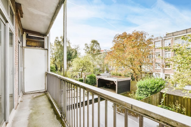 Graceful balcony with a unique view of multi-storey brick houses