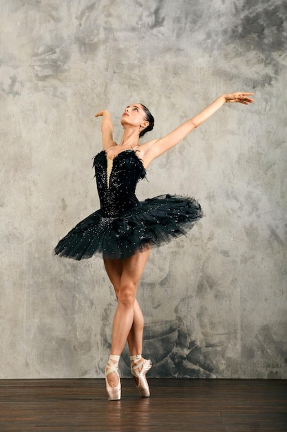 Graceful ballerina dancing in pointe shoes