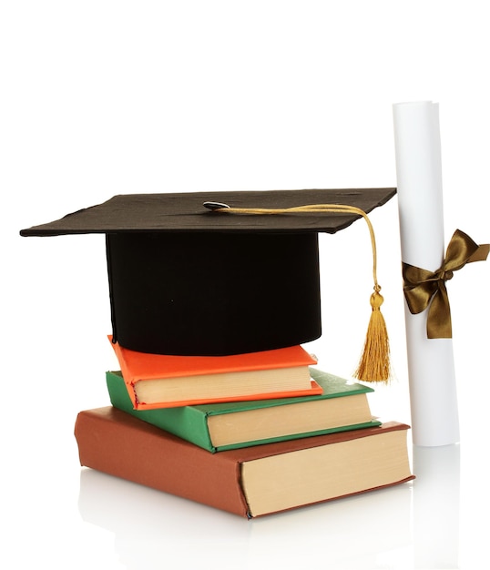 Grad hat and diploma with books isolated on white