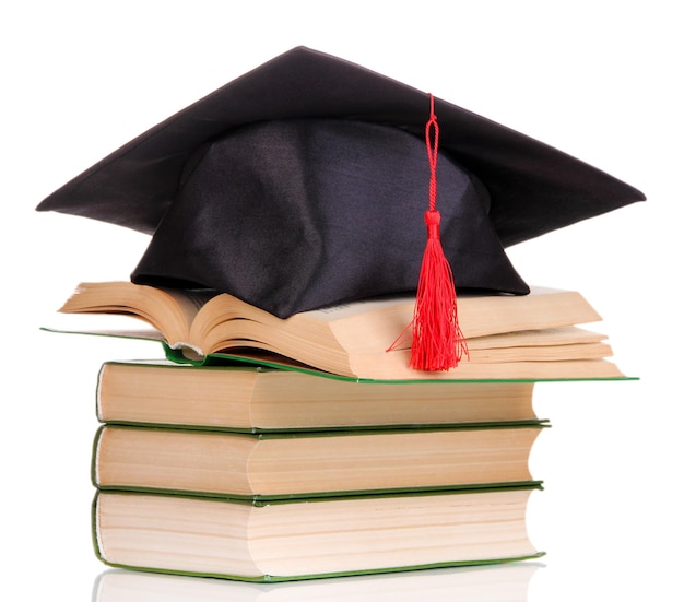 白で隔離の本と卒業生の帽子
