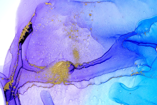 Gradient acrylic abstract blue and purple background with gold powder.