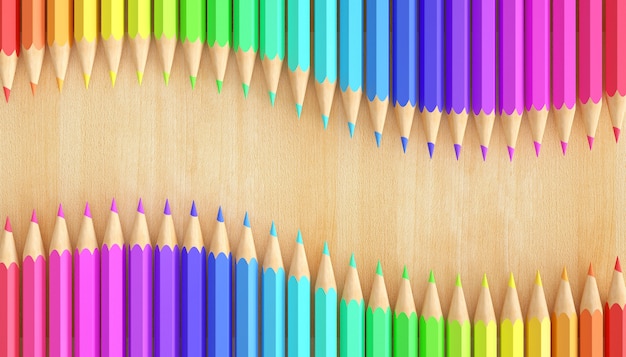 Gradient colored pencils on natural wood background.