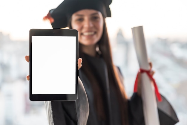 Graduate holding tablet mock-up