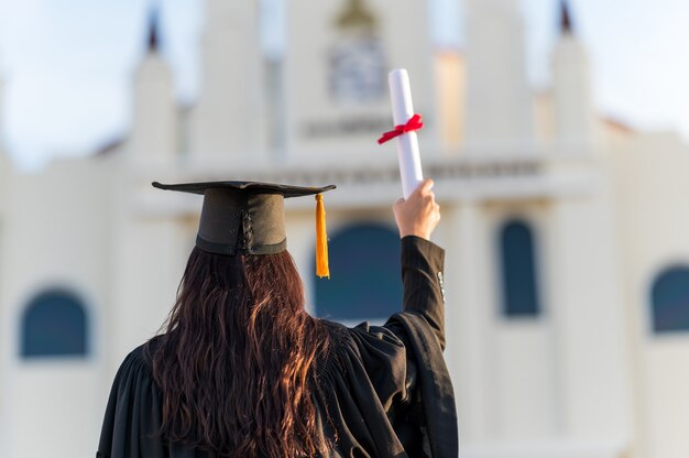 graduates wear a black hat to stand for congratulations on graduation	