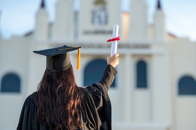 graduates wear a black hat to stand for congratulations on graduation	