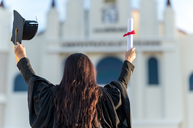graduates wear a black hat to stand for congratulations on graduation	
