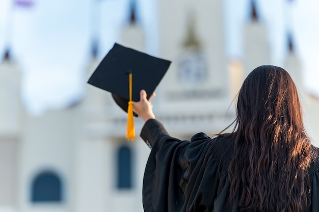 graduates wear a black hat to stand for congratulations on graduation	