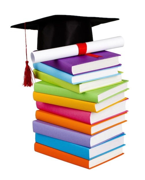 Graduation cap and diploma on top of books - isolated image