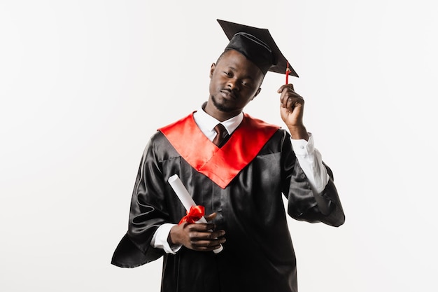 Graduation Happy african man smiling and holding diploma with honors in his hands on white background Graduate african man graduated from university and got master degree