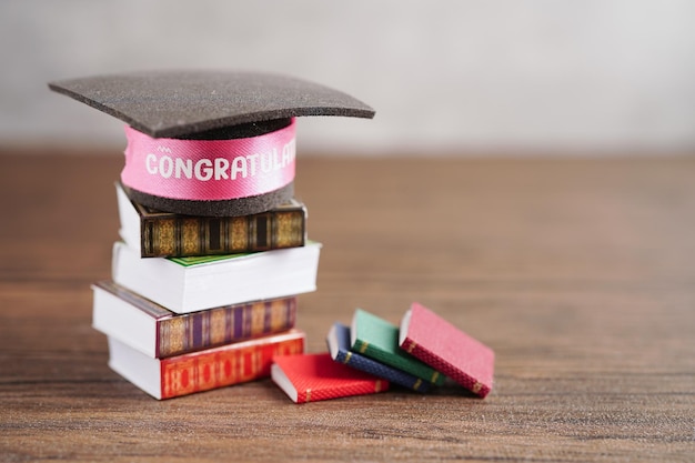 Graduation hat on book with copy space learning university education concept