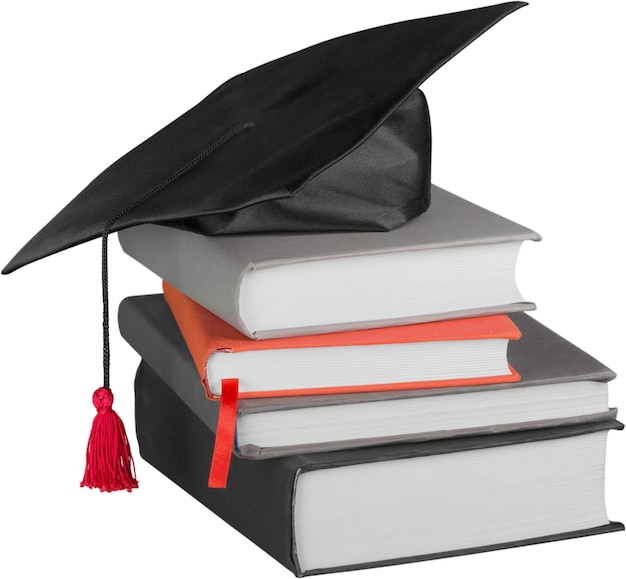 Graduation hat on books, Isolated