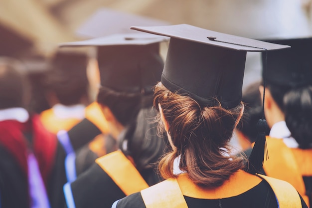 Graduation,Student hold hats in hand during commencement success graduates of the university,Concept education congratulation