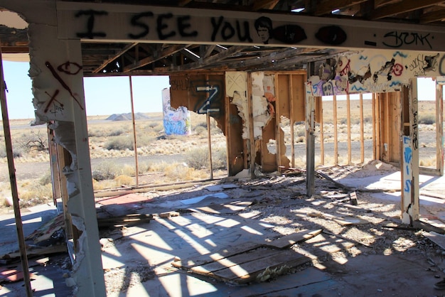 Graffiti on roof beam in abandoned building