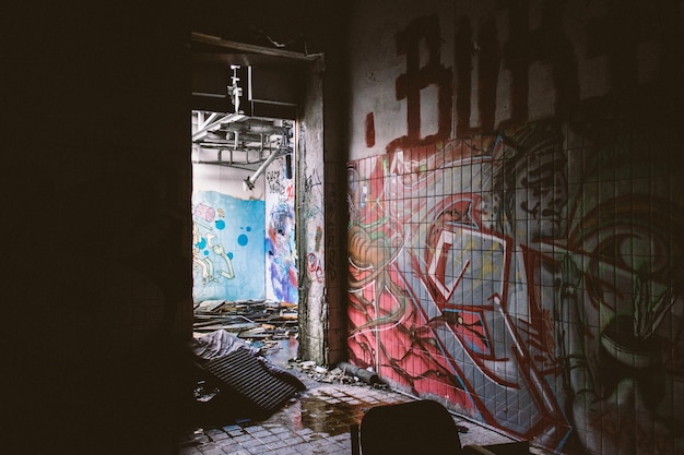 Photo graffiti on walls in abandoned building