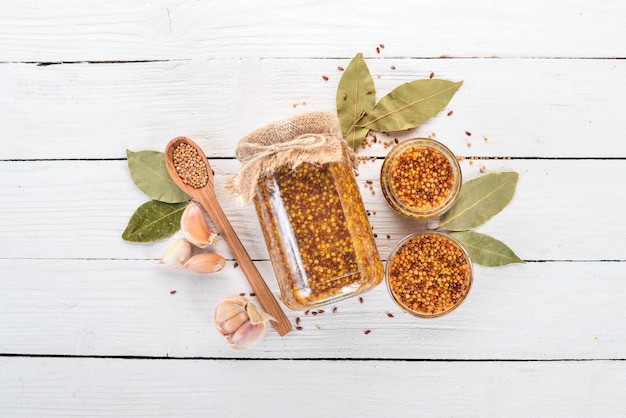 Grain Mustard Spices On a white wooden background Top view Copy space for your text