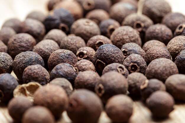 Photo grains of black pepper background. black pepper peas