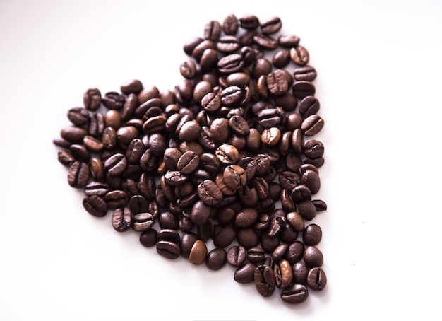 Grains of roasted coffee in the shape of heart