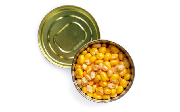 Grains of sweet canned corn in a can Isolated on white background