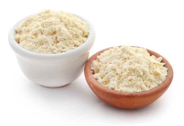 Gram flour in bowl over white background