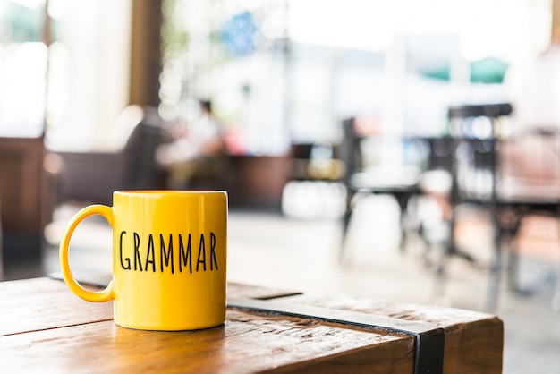 Photo grammar word on yellow cup