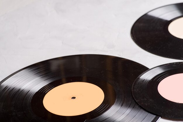 Gramophone record of different sizes on a light background